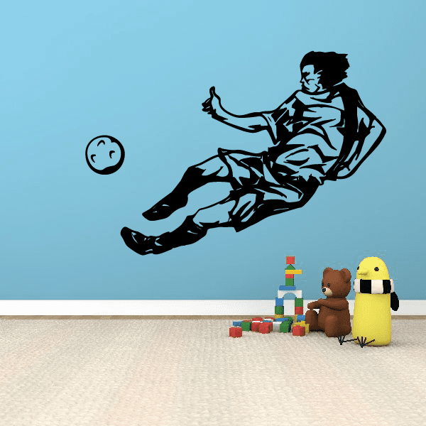 Soccer wall decal: black vinyl soccer player kicking beside a soccer ball