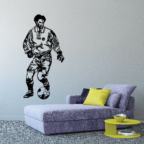 Soccer player wall decal: black silhouette holding a soccer ball