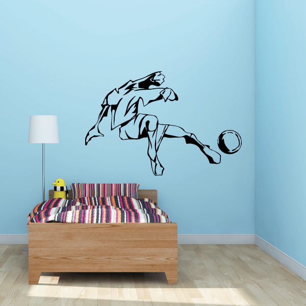Soccer player wall decal in black, kicking pose with ball