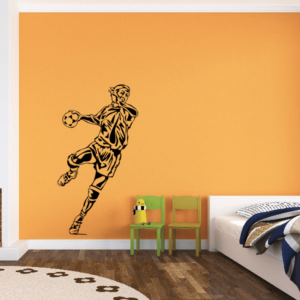Soccer player vinyl wall decal with a football in hand, black and tan design