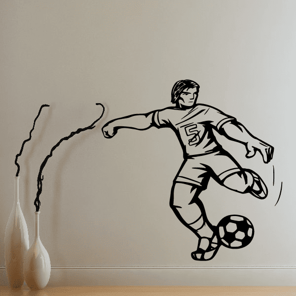 Soccer player vinyl wall decal, black silhouette kicking a soccer ball