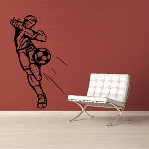 Soccer wall decal featuring a black soccer player kicking a ball silhouette