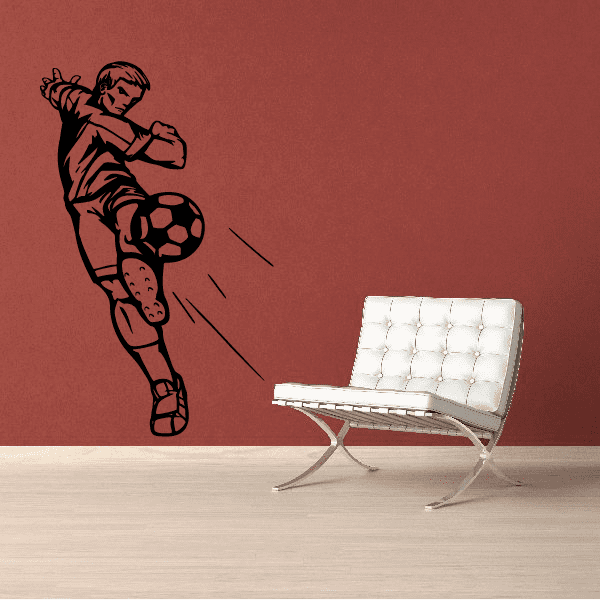 Soccer wall decal featuring a black soccer player kicking a ball silhouette