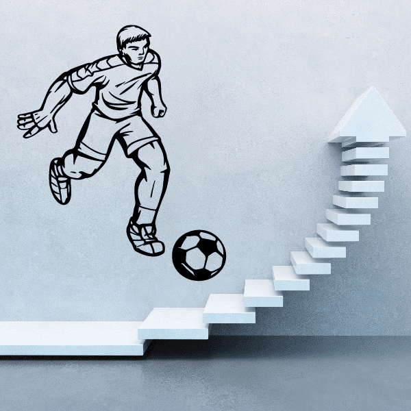 Soccer wall decal of player kicking ball with upward arrow