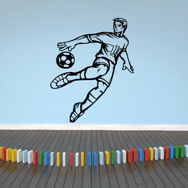 Soccer wall decal of black soccer player kicking a ball
