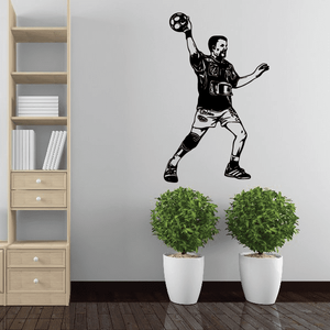 Black soccer player wall vinyl decal with ball above head, full-body silhouette.