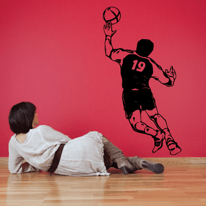Soccer wall decal vinyl: black soccer player silhouette holding a ball, jersey number 19.