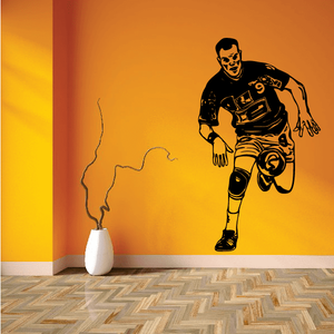 Soccer wall vinyl decal: black running soccer player silhouette