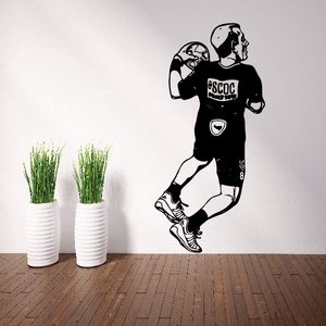 Soccer player wall vinyl decal, black running silhouette with ball near feet