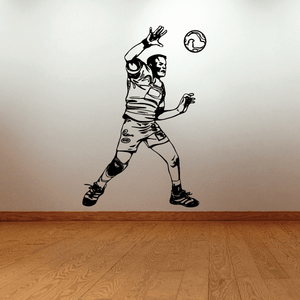 Soccer wall decal of black-and-white soccer player kicking ball