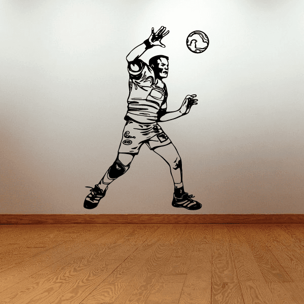 Soccer wall decal of black-and-white soccer player kicking ball