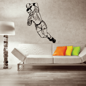 Soccer player wall decal, black and white vinyl figure in mid-kick pose.