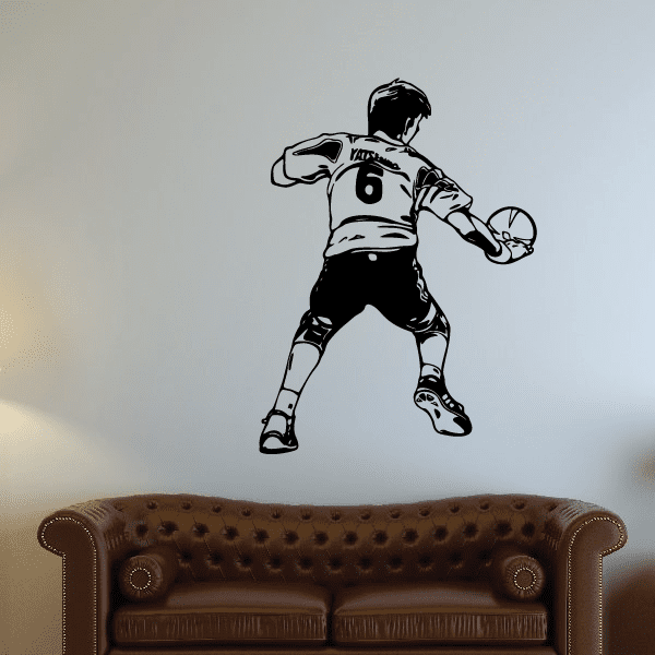 Black soccer player wall vinyl decal in ball-kick pose