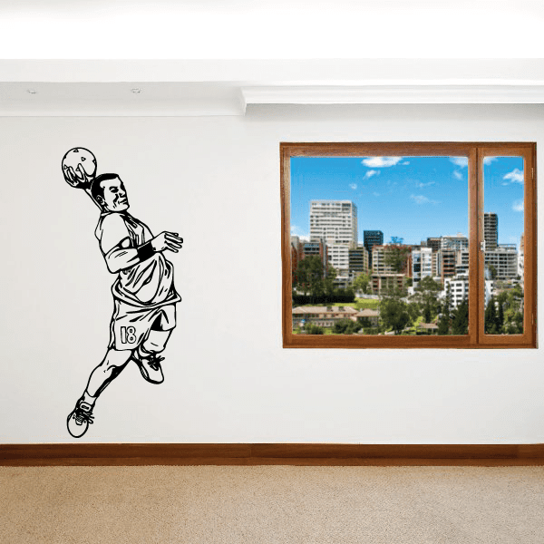 Black soccer player wall decal running and kicking ball, vinyl sticker silhouette