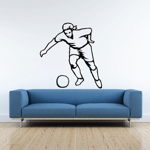 Soccer wall decal: black and white soccer player kicking a ball
