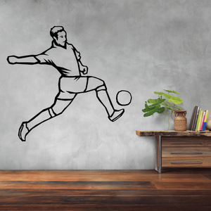 Soccer wall decal of a black soccer player silhouette mid-kick