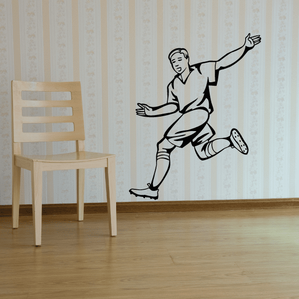 Soccer wall decal vinyl sticker of a black soccer player kicking a ball