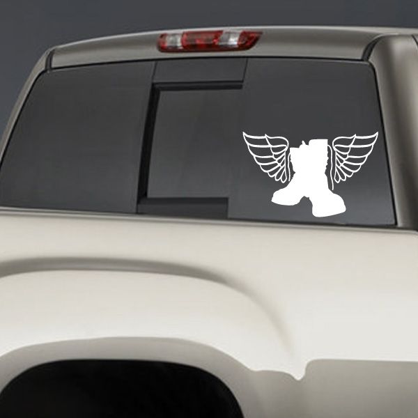 Winged boot silhouette decal with white boots and wings on dark surface