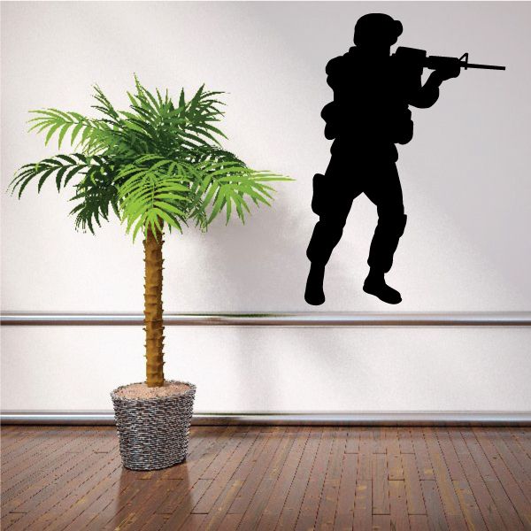 Soldier shooting rifle decal, black silhouette of armed soldier standing in profile