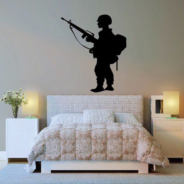 Black soldier with backpack and rifle decal on bedroom headboard