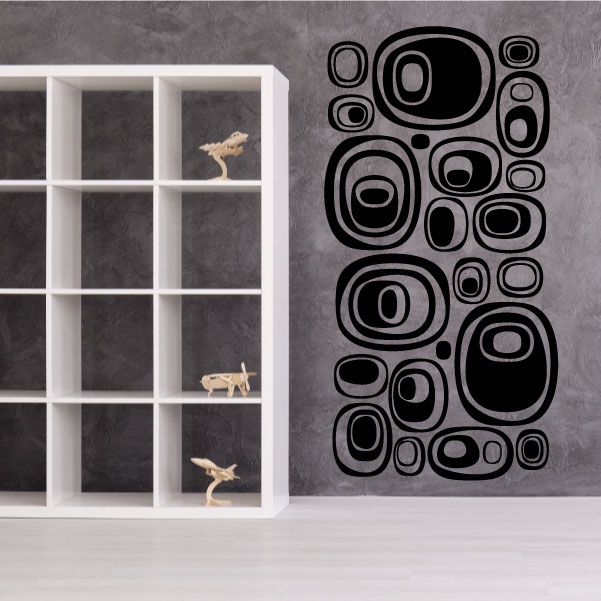 Futuristic pebble wall decal set with black circular ring shapes and dots