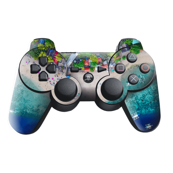 Sony PlayStation 3 controller skin wrap with colorful graphic; buttons and sticks visible