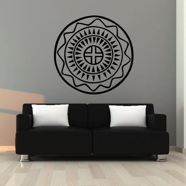 Circular sunburst cross wall decal with black outline and rays pattern