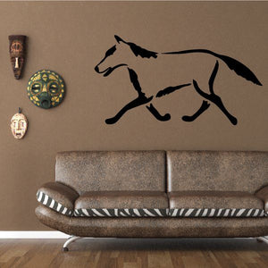 Black Southwestern-style coyote wall decal with running silhouette
