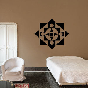 Geometric pointed cross wall decal in black with circular accents