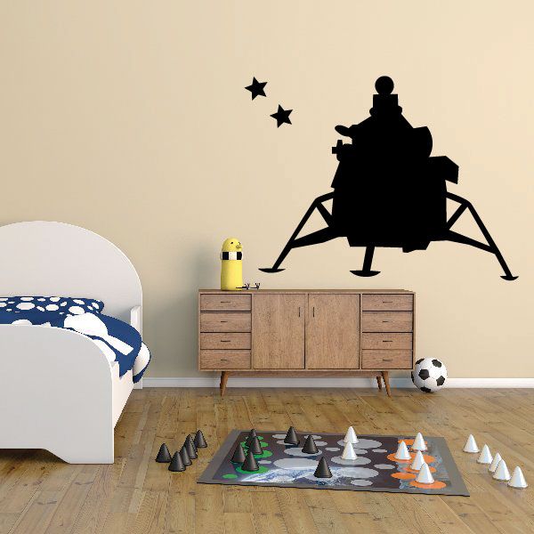 Space pod wall decal with black rocket silhouette and small star accents