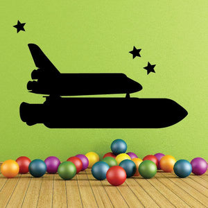 Space shuttle decal with black shuttle silhouette and small star accents