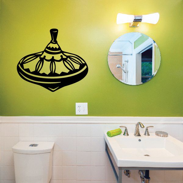 Black spin top vinyl wall decal with line-art design
