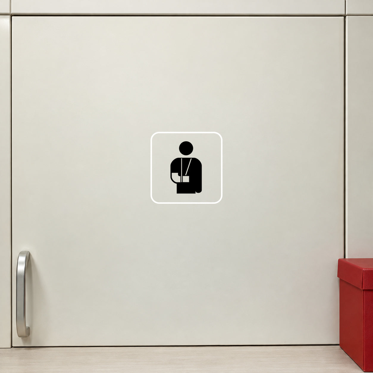 Medical help sign decal with a black person icon inside a white square outline