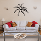 Black spider decal with spread legs and flame-like accents on wall