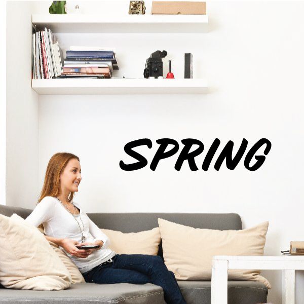 Spring wall decal with bold black 'SPRING' script lettering