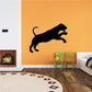 Springing tiger wall decal silhouette, black with open mouth and raised tail.