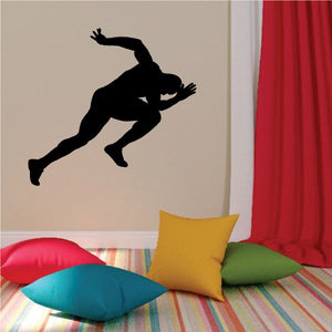 Sprinting male runner wall decal with black silhouette in a mid-run pose.