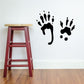 Black paw print decal set with three paw shapes