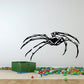 Black stalking spider wall decal with long legs
