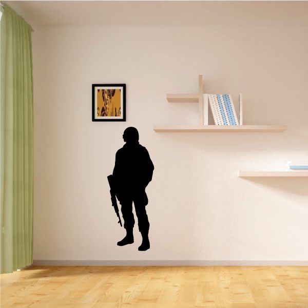 Soldier holding rifle wall decal with dark silhouette and full-body standing pose