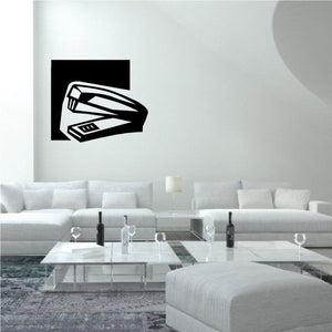 Stapler wall decal with black square background and white stapler icon