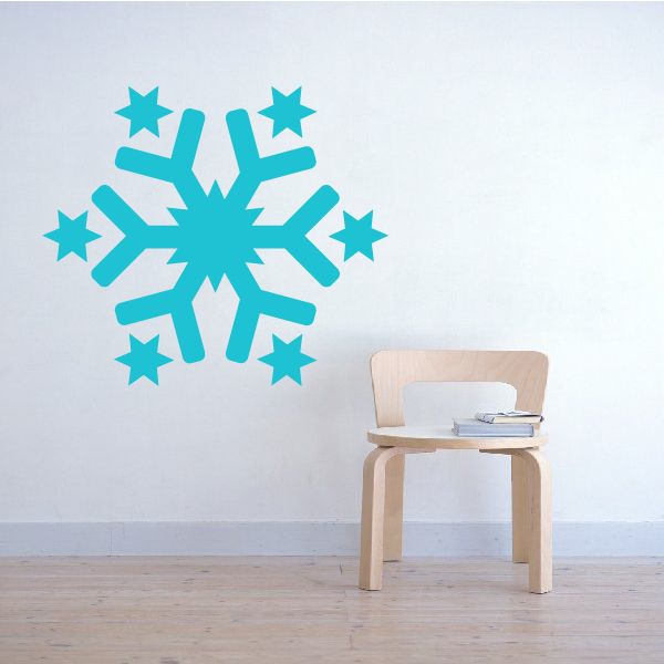 Turquoise star cross snowflake wall decal with small star accents