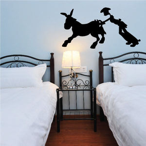 Vinyl wall decal of a donkey carrying a rider, black silhouette