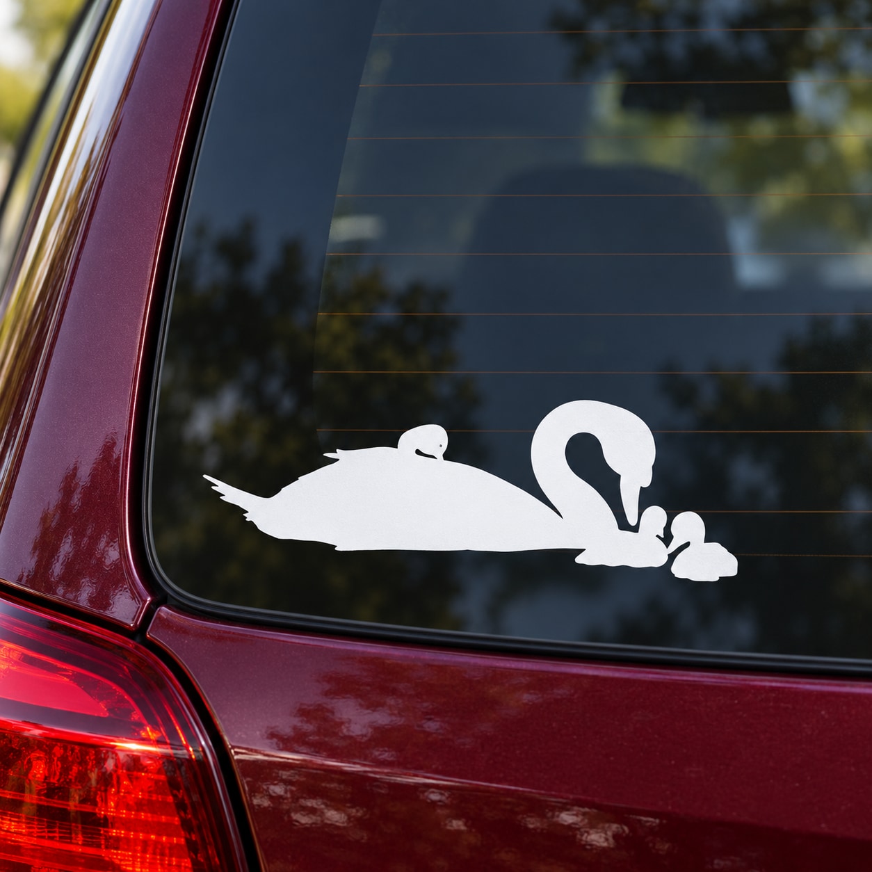 White swan and baby cygnets car window decal, silhouetted in profile