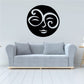 Black circular swirl moon face decal with white swirling eyes and smile