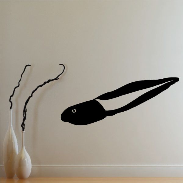 Black tadpole frog wall decal with long tail and small eye