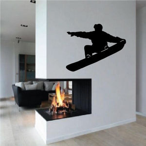 Snowboarding decal with black silhouette rider on snowboard, tail grab pose