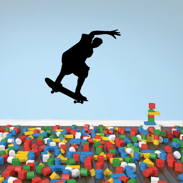 Black skateboarder silhouette vinyl wall decal, mid-trick pose