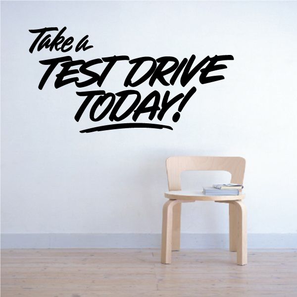 Vinyl wall decal: 'Take a test drive today!' bold black lettering