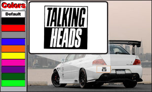 Talking Heads decal with black 'TALKING HEADS' lettering on white square.